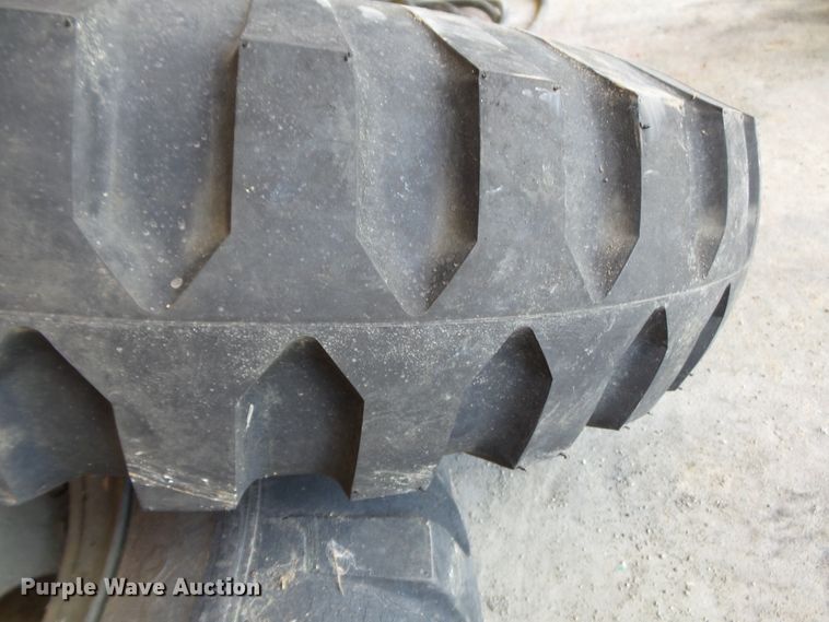 image for item DE7910 (2) 9.00-16 tires and wheels