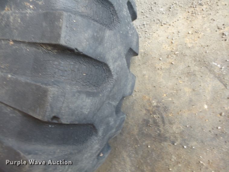 image for item DE7910 (2) 9.00-16 tires and wheels