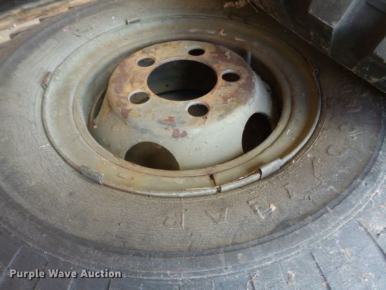 image for item DE7910 (2) 9.00-16 tires and wheels