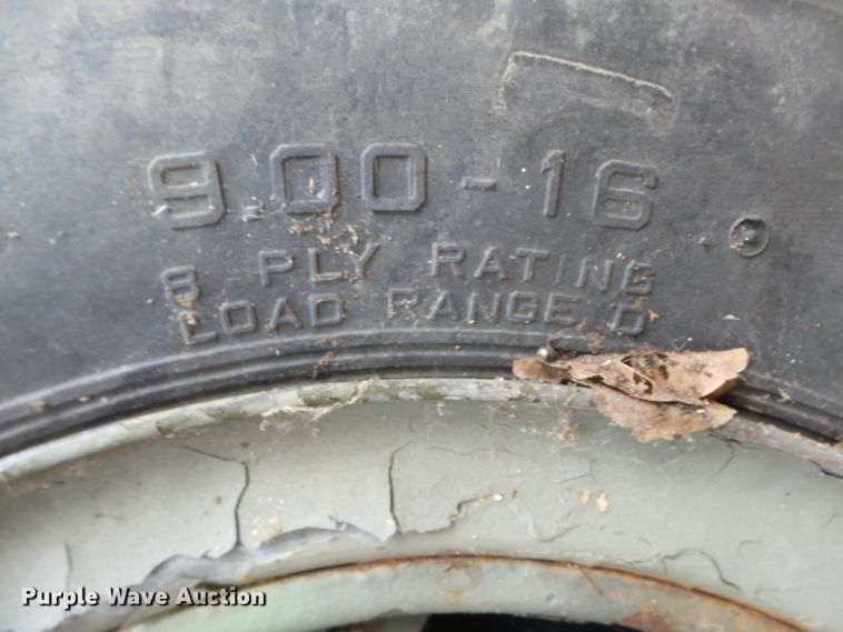 image for item DE7910 (2) 9.00-16 tires and wheels