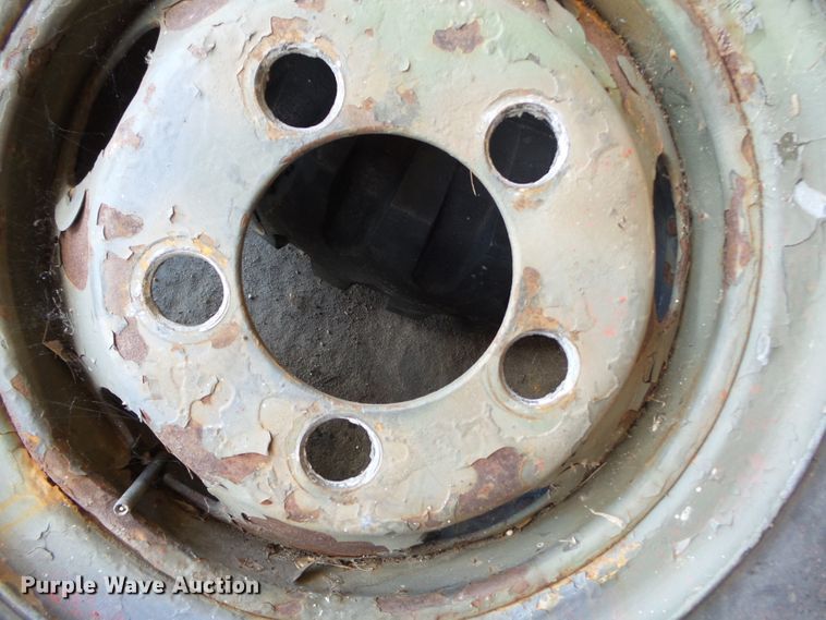 image for item DE7910 (2) 9.00-16 tires and wheels