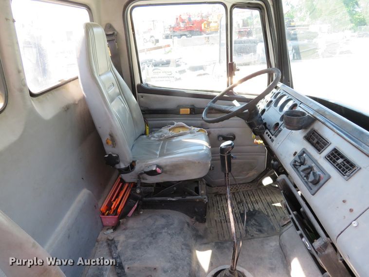 image for item DE8215 1998 Freightliner FL112 flatbed truck