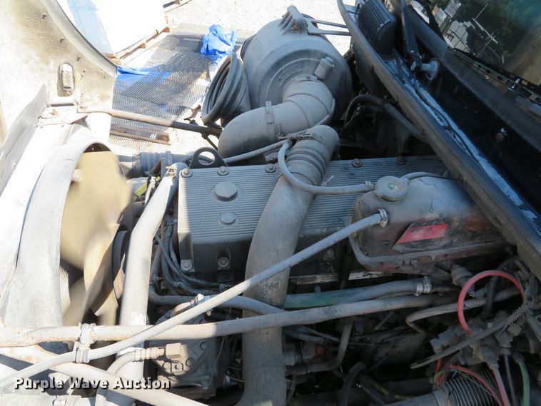 image for item DE8215 1998 Freightliner FL112 flatbed truck