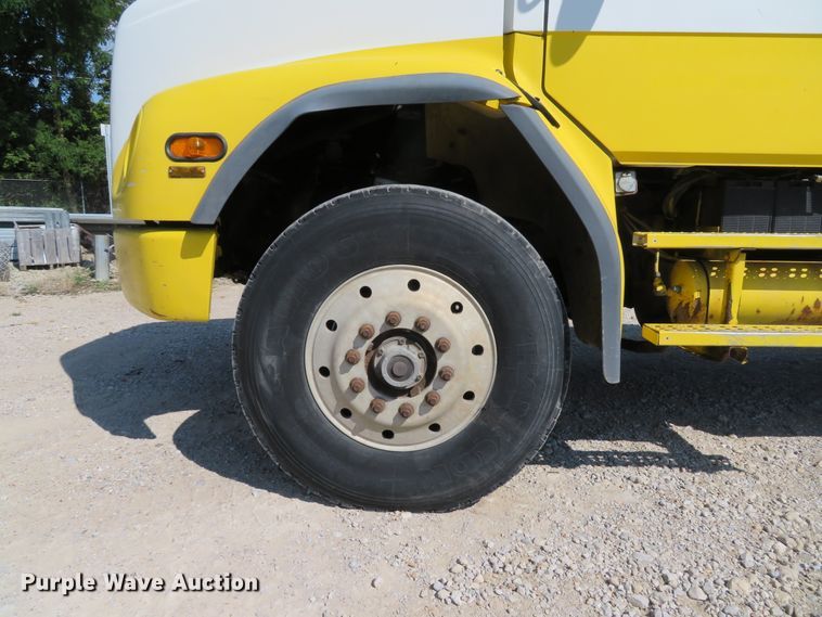 image for item DE8215 1998 Freightliner FL112 flatbed truck