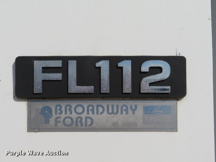 image for item DE8215 1998 Freightliner FL112 flatbed truck