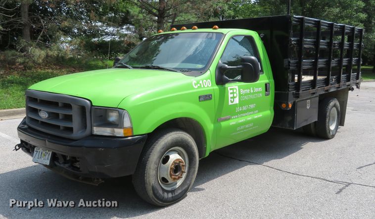 image for item DE8234 2004 Ford F350 Super Duty XL flatbed pickup truck