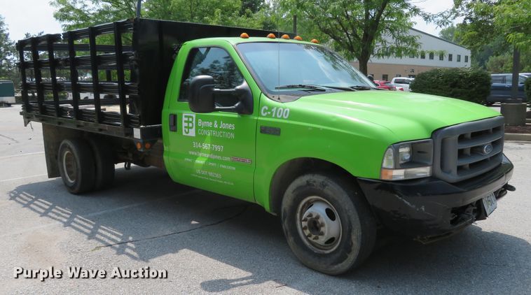 image for item DE8234 2004 Ford F350 Super Duty XL flatbed pickup truck