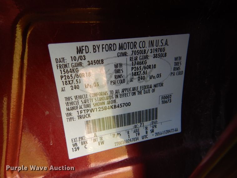 image for item DG4824 2004 Ford F150 Lariat SuperCrew flatbed pickup truck