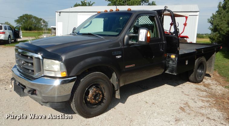 image for item DG4830 2004 Ford F350 Super Duty XLT flatbed pickup truck