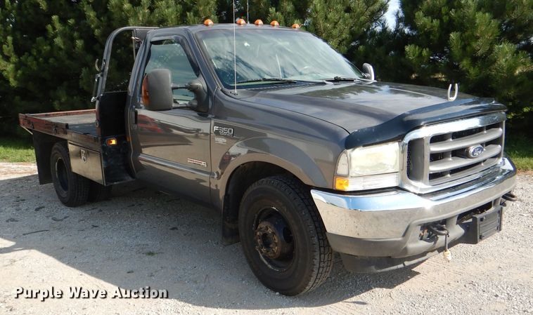 image for item DG4830 2004 Ford F350 Super Duty XLT flatbed pickup truck