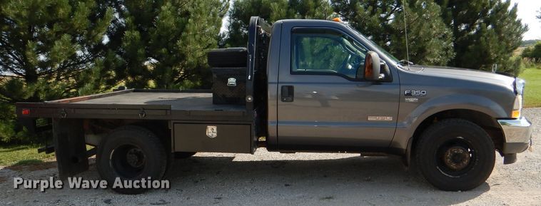 image for item DG4830 2004 Ford F350 Super Duty XLT flatbed pickup truck