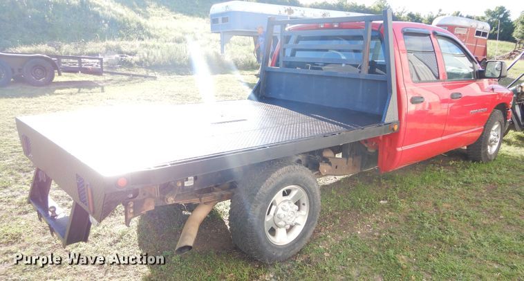 image for item FI9929 2003 Dodge Ram 2500 Quad Cab flatbed pickup truck