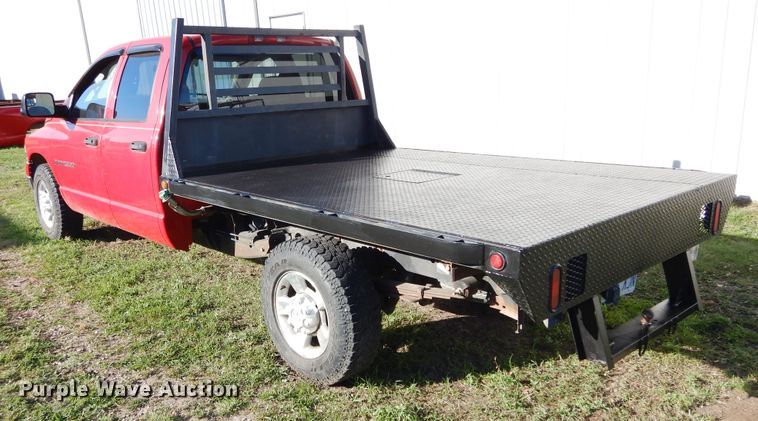 image for item FI9929 2003 Dodge Ram 2500 Quad Cab flatbed pickup truck