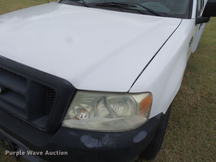 image for item FL9313 2006 Ford F150 utility bed pickup truck