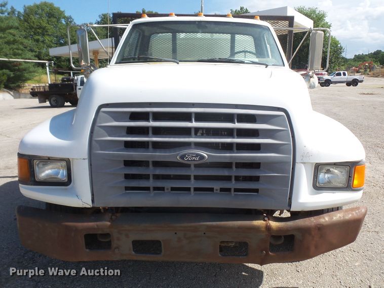 image for item DD6296 1998 Ford F700 flatbed truck with pressure washer