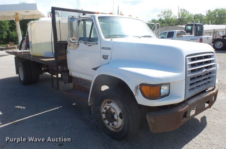 image for item DD6296 1998 Ford F700 flatbed truck with pressure washer
