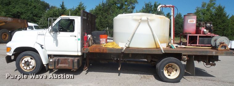 image for item DD6296 1998 Ford F700 flatbed truck with pressure washer