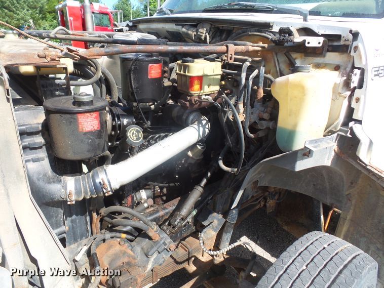 image for item DD6296 1998 Ford F700 flatbed truck with pressure washer