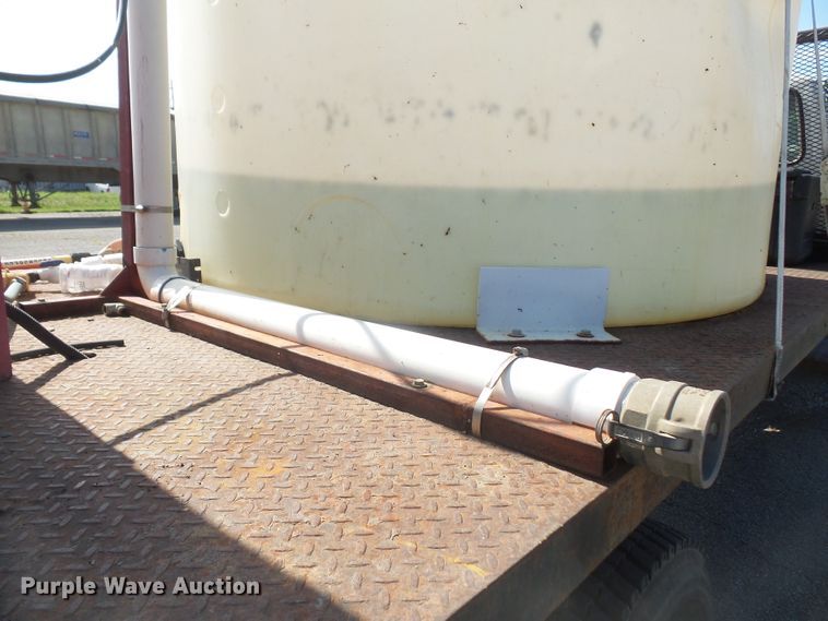 image for item DD6296 1998 Ford F700 flatbed truck with pressure washer