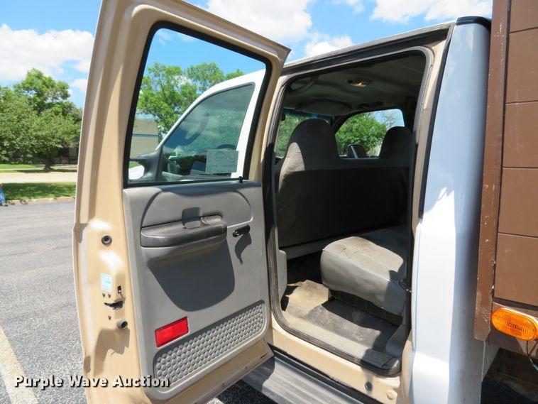 image for item DE8242 2006 Ford F450 Super Duty XL Crew Cab flat dump bed truck