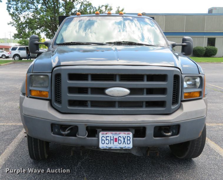 image for item DE8243 2005 Ford F450 Super Duty XL Crew Cab flat dump bed truck