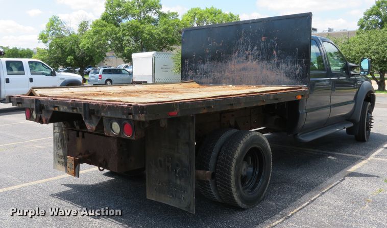 image for item DE8243 2005 Ford F450 Super Duty XL Crew Cab flat dump bed truck