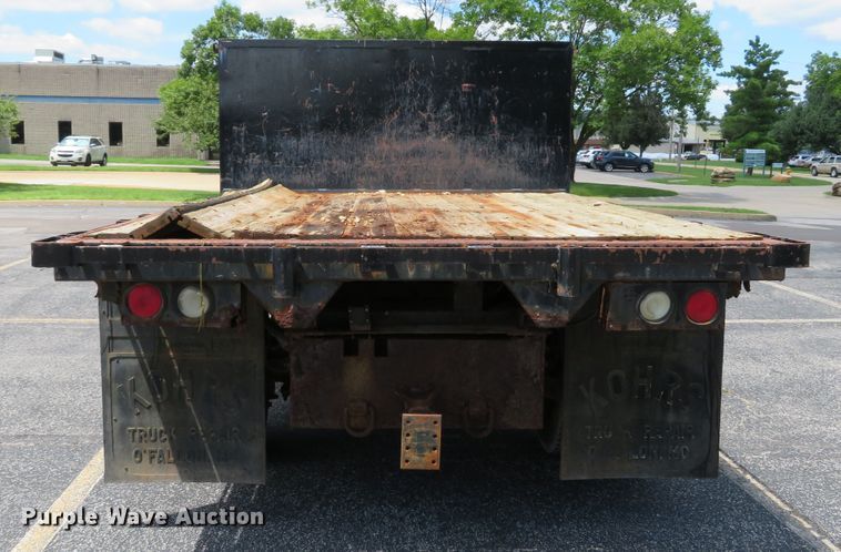 image for item DE8243 2005 Ford F450 Super Duty XL Crew Cab flat dump bed truck