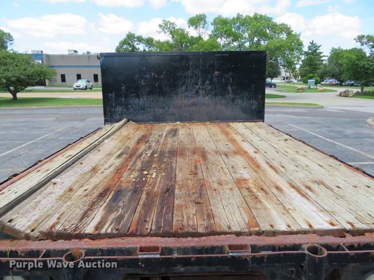 image for item DE8243 2005 Ford F450 Super Duty XL Crew Cab flat dump bed truck