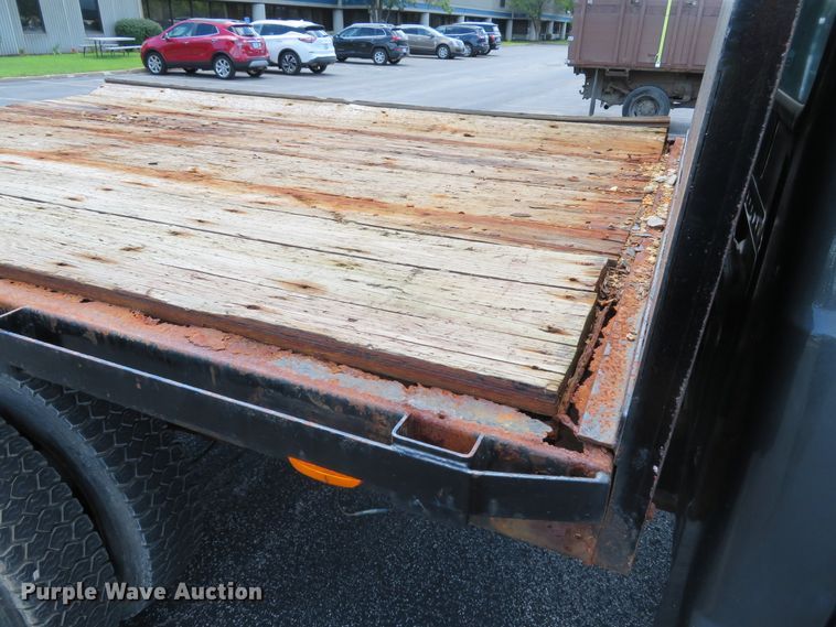 image for item DE8243 2005 Ford F450 Super Duty XL Crew Cab flat dump bed truck