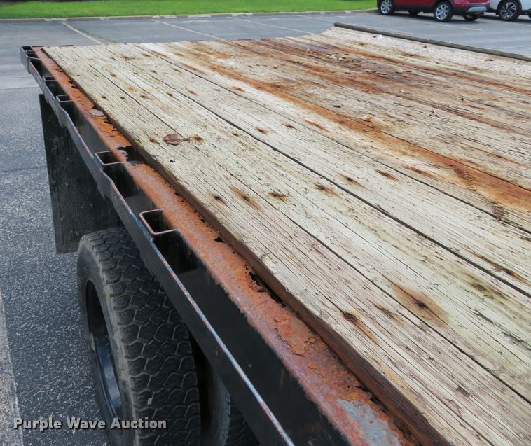 image for item DE8243 2005 Ford F450 Super Duty XL Crew Cab flat dump bed truck