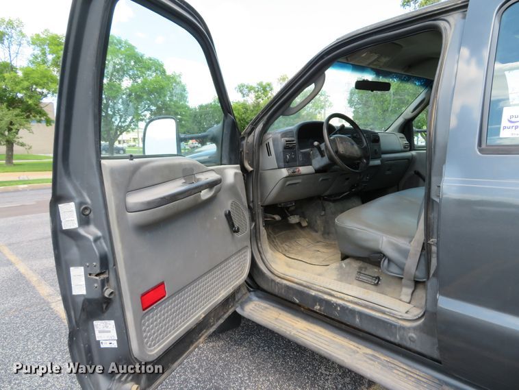 image for item DE8243 2005 Ford F450 Super Duty XL Crew Cab flat dump bed truck