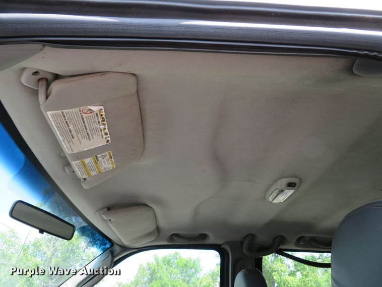 image for item DE8243 2005 Ford F450 Super Duty XL Crew Cab flat dump bed truck