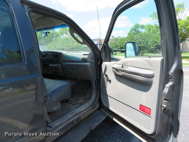 image for item DE8243 2005 Ford F450 Super Duty XL Crew Cab flat dump bed truck