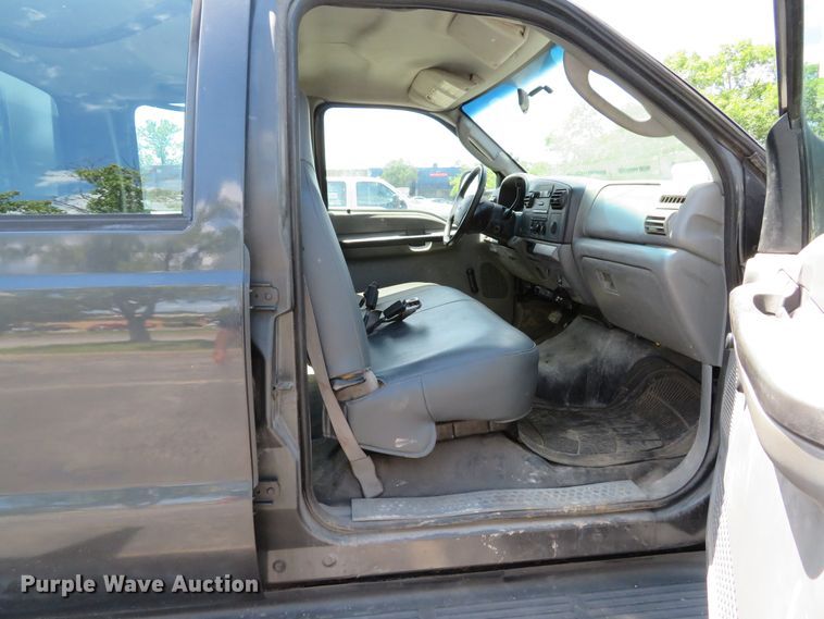 image for item DE8243 2005 Ford F450 Super Duty XL Crew Cab flat dump bed truck