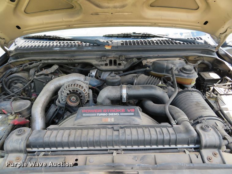 image for item DE8243 2005 Ford F450 Super Duty XL Crew Cab flat dump bed truck