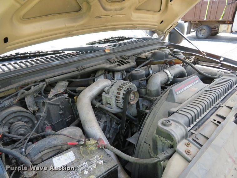 image for item DE8243 2005 Ford F450 Super Duty XL Crew Cab flat dump bed truck