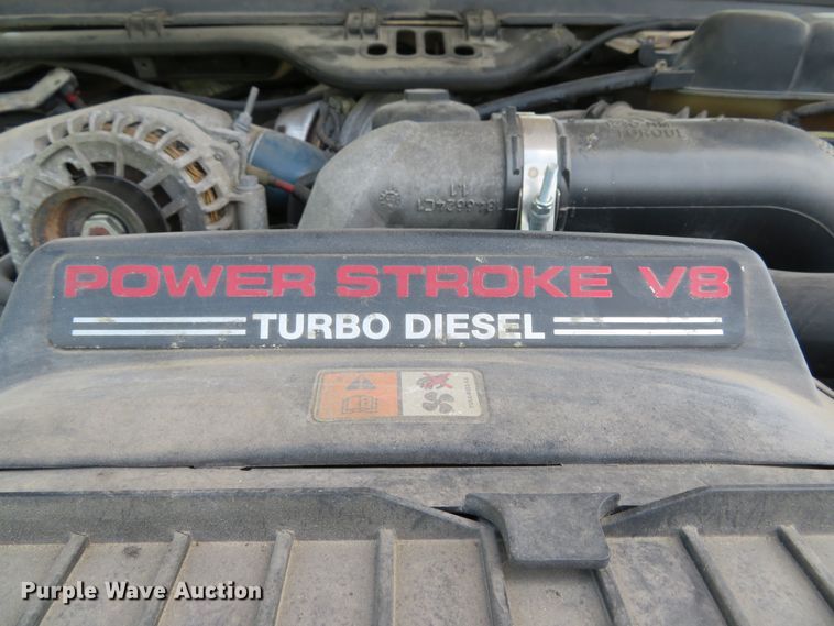 image for item DE8243 2005 Ford F450 Super Duty XL Crew Cab flat dump bed truck