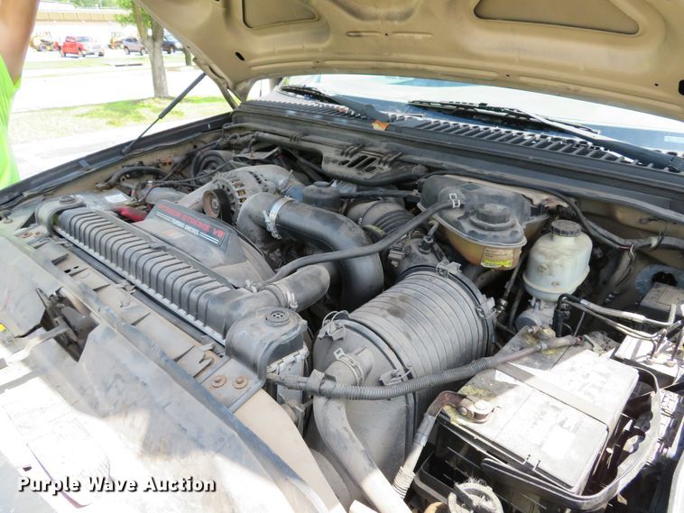 image for item DE8243 2005 Ford F450 Super Duty XL Crew Cab flat dump bed truck