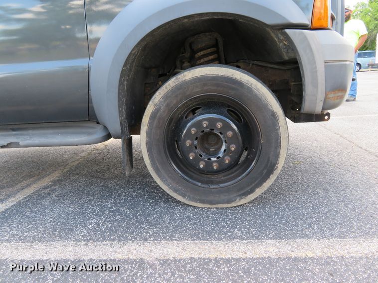 image for item DE8243 2005 Ford F450 Super Duty XL Crew Cab flat dump bed truck