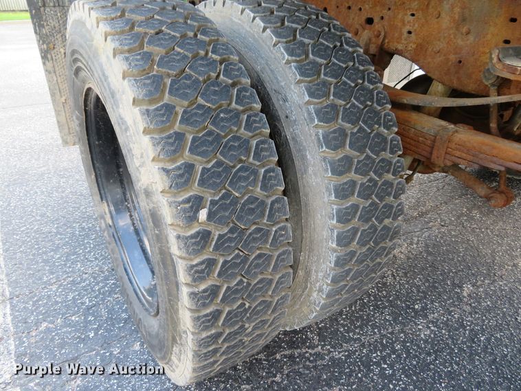 image for item DE8243 2005 Ford F450 Super Duty XL Crew Cab flat dump bed truck