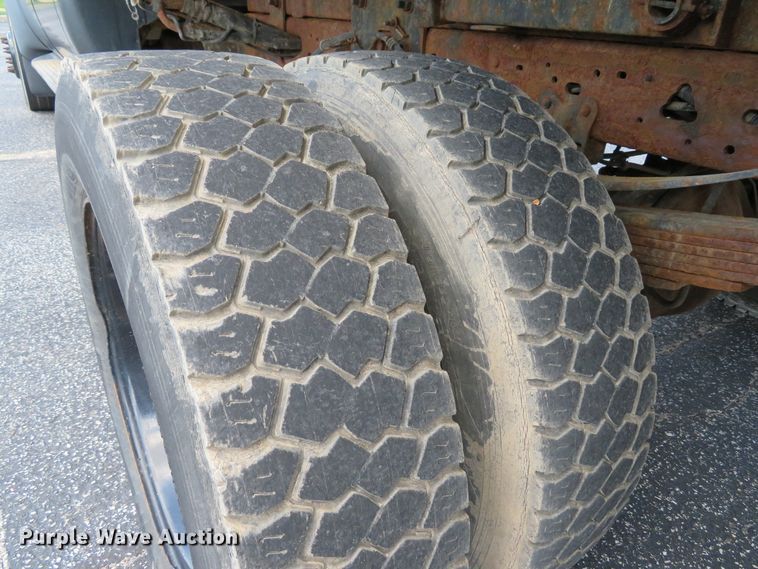 image for item DE8243 2005 Ford F450 Super Duty XL Crew Cab flat dump bed truck