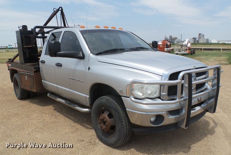 image for item DC5066 2005 Dodge Ram 3500 Quad Cab flatbed pickup truck