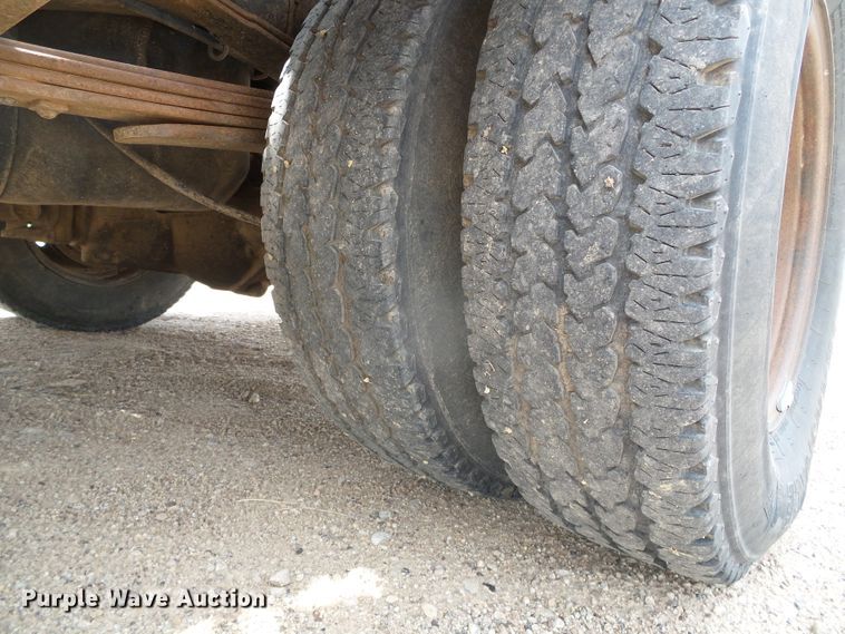 image for item DC5066 2005 Dodge Ram 3500 Quad Cab flatbed pickup truck