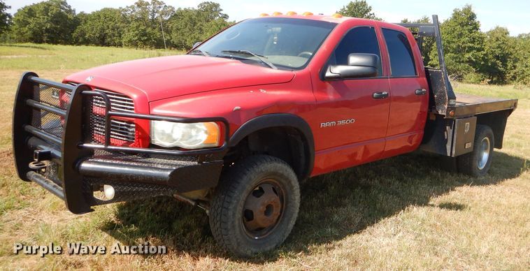 image for item FC9756 2003 Dodge Ram 3500 Quad Cab flatbed pickup truck