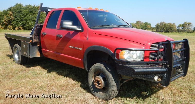 image for item FC9756 2003 Dodge Ram 3500 Quad Cab flatbed pickup truck