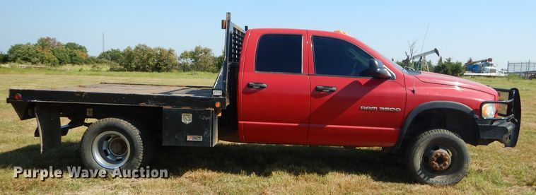 image for item FC9756 2003 Dodge Ram 3500 Quad Cab flatbed pickup truck