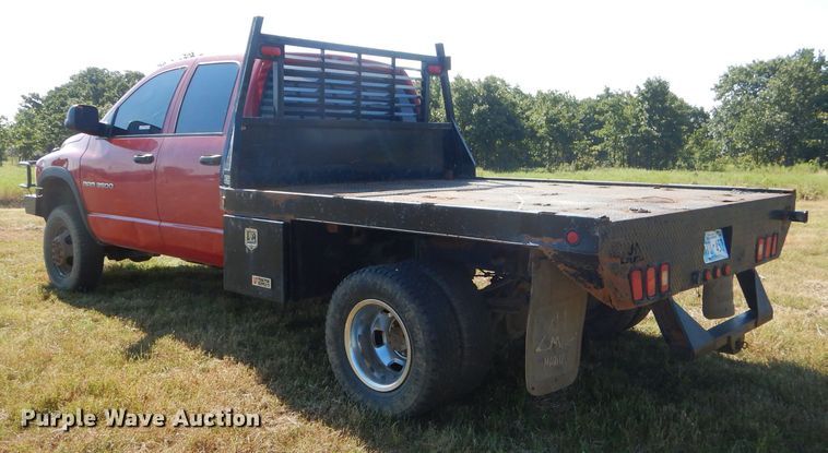 image for item FC9756 2003 Dodge Ram 3500 Quad Cab flatbed pickup truck