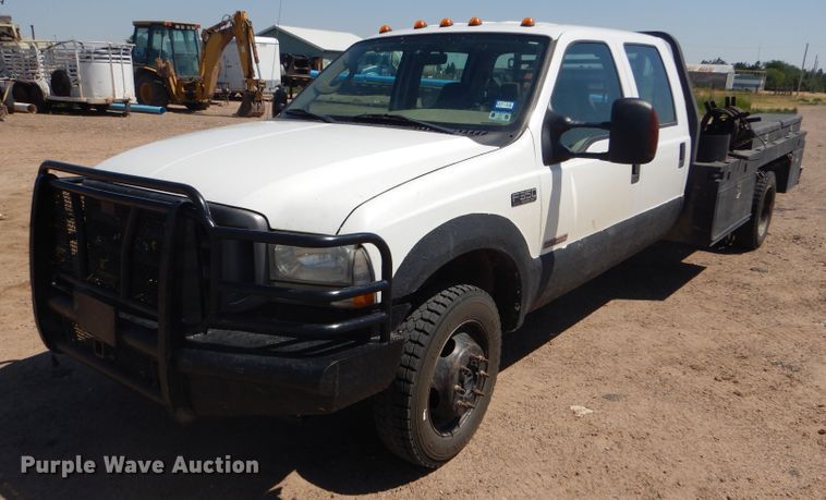 image for item FY9691 2004 Ford F350 Super Duty XLT Crew Cab utility bed pickup truck