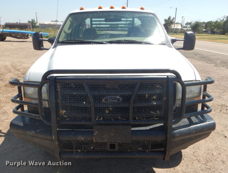 image for item FY9691 2004 Ford F350 Super Duty XLT Crew Cab utility bed pickup truck