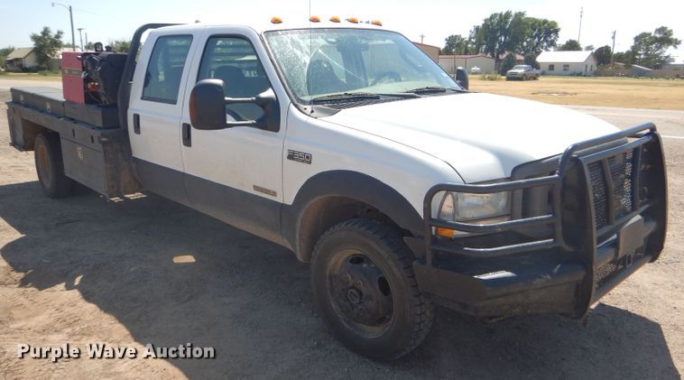 image for item FY9691 2004 Ford F350 Super Duty XLT Crew Cab utility bed pickup truck